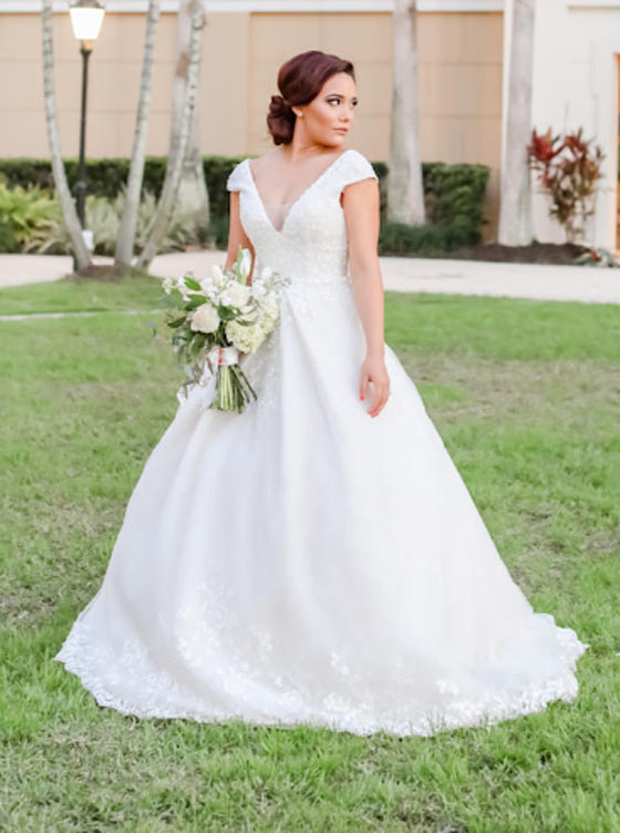 Bride Outdoors Holding Flowers